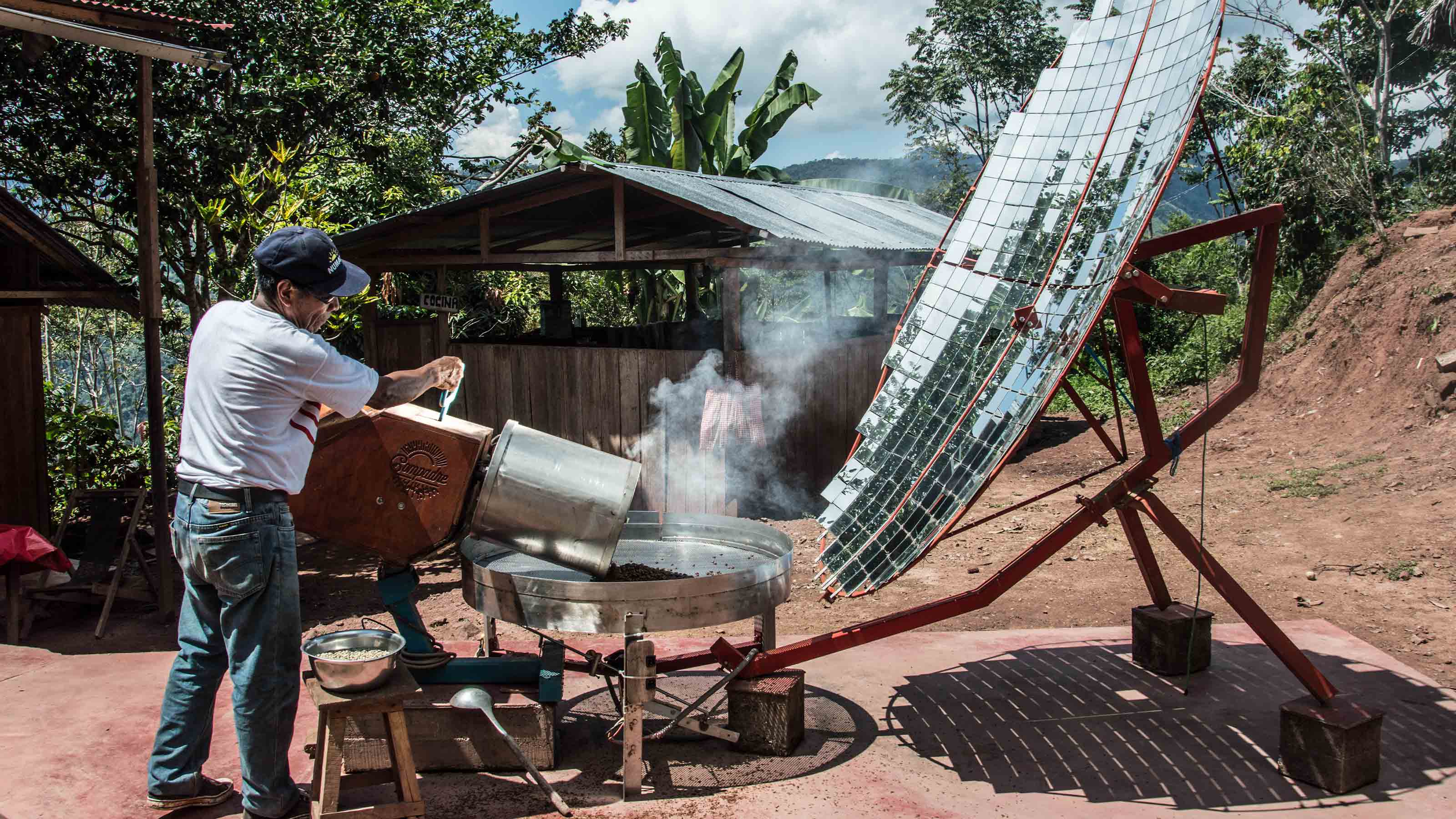 Man roasting coffee via solar power