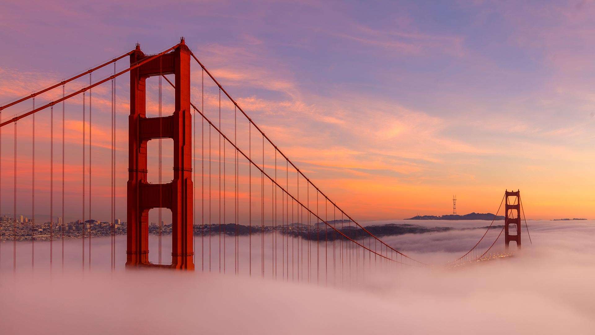 Golden Gate Bridge at sunrise with fog